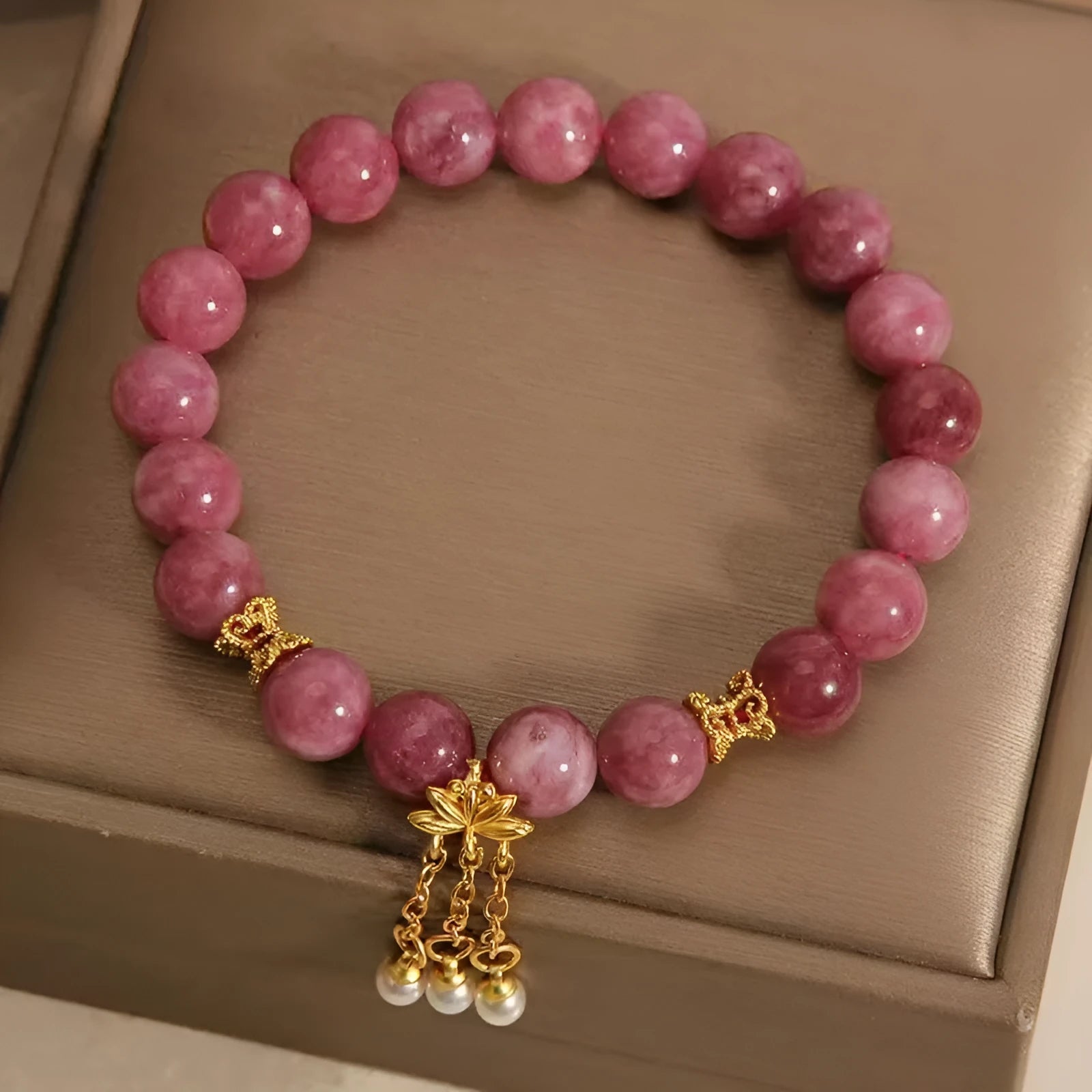 Pink lotus and pink white crystal natural stone bracelet with pearl pendant and lotus tassel in new Chinese style.