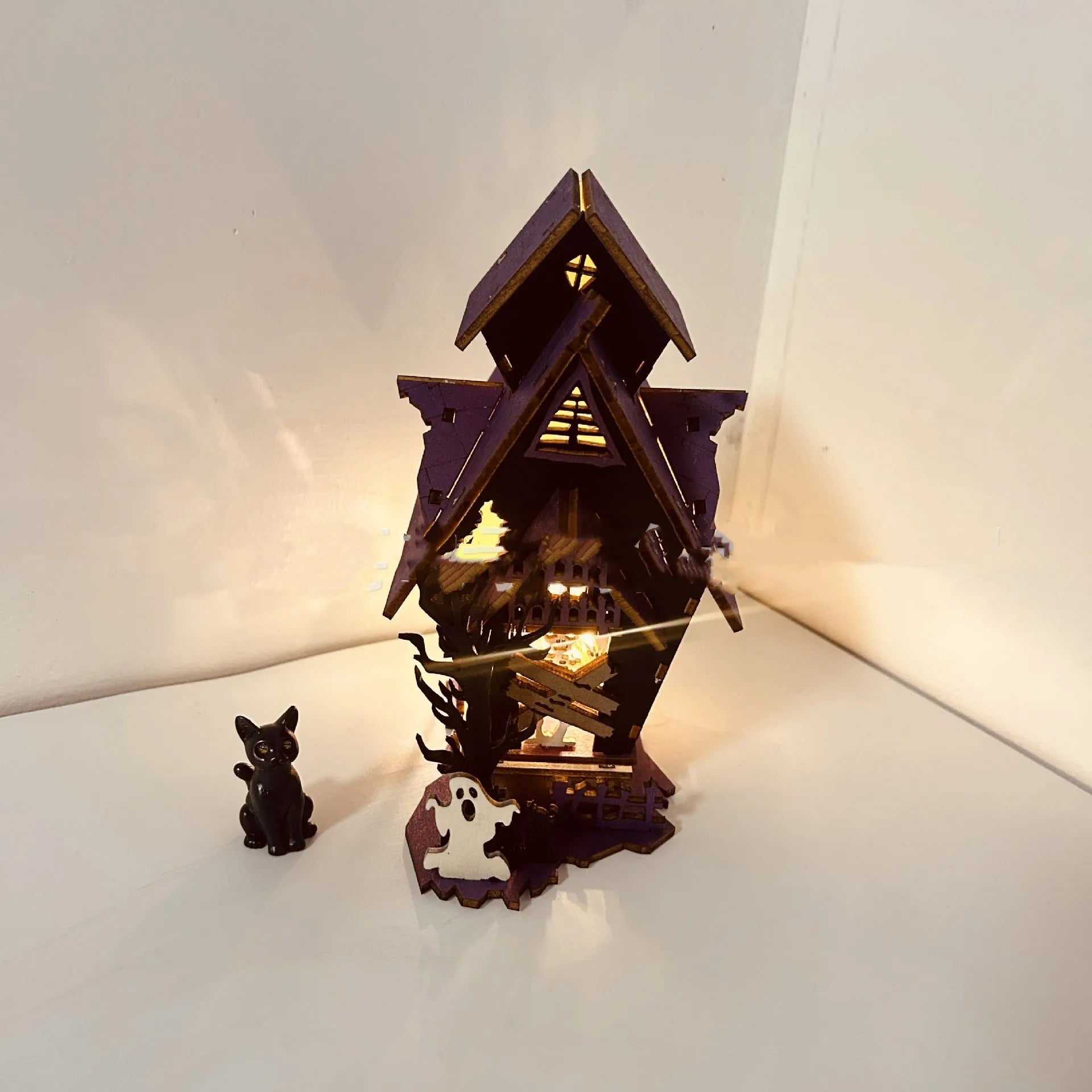 Wooden Halloween haunted house decoration with luminous finish on tabletop