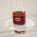 Women's PVC bucket shoulder bag with heart pattern in assorted colours