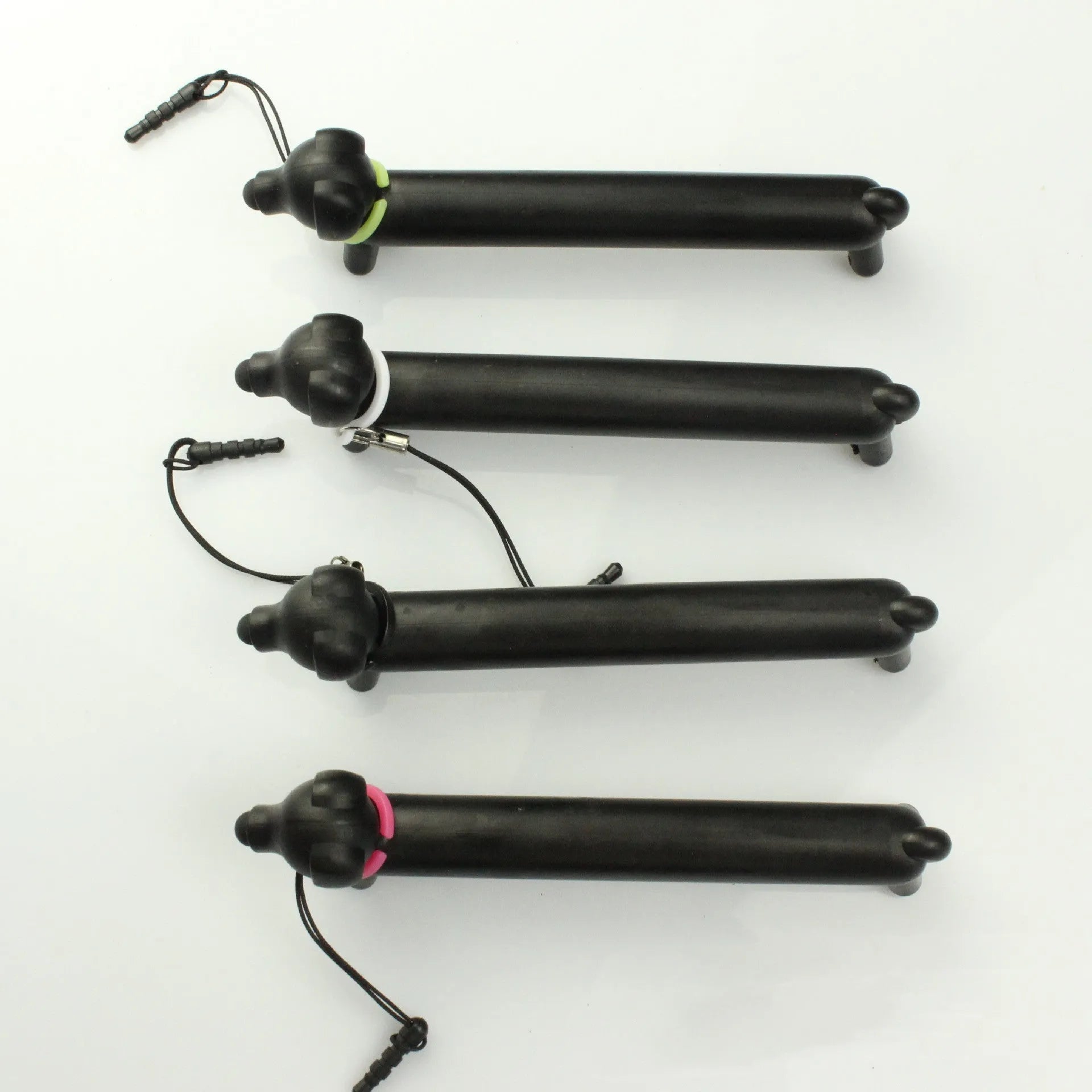 Black dog-shaped touch screen stylus with conductive construction shown next to its carry pouch