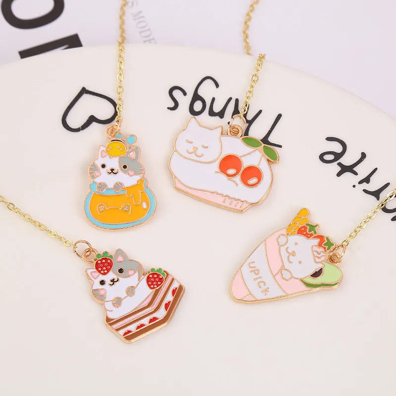 Jane Lime metal cat bookmark with food-themed designs including Strawberry Cake Cat and Cherry Sleeping Cat