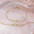 Stainless steel bracelet or necklace with diamond accents around digital numerals in gold, rose gold, or steel colour.