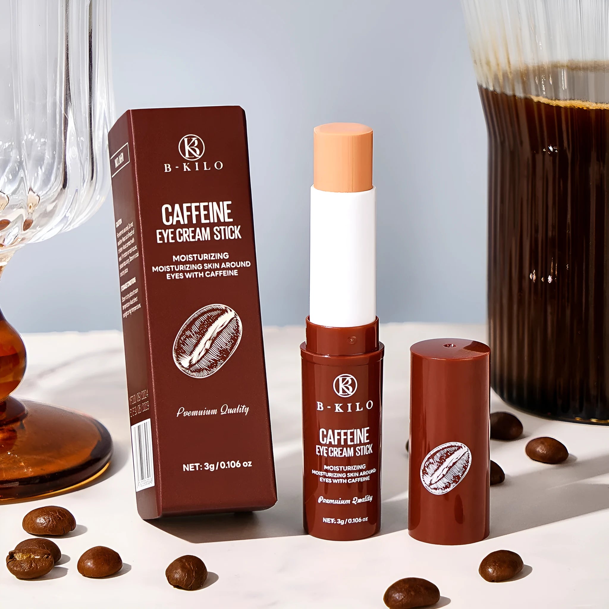 Caffeine eye cream stick in white applicator, 3g net content for dark circles and fine lines.