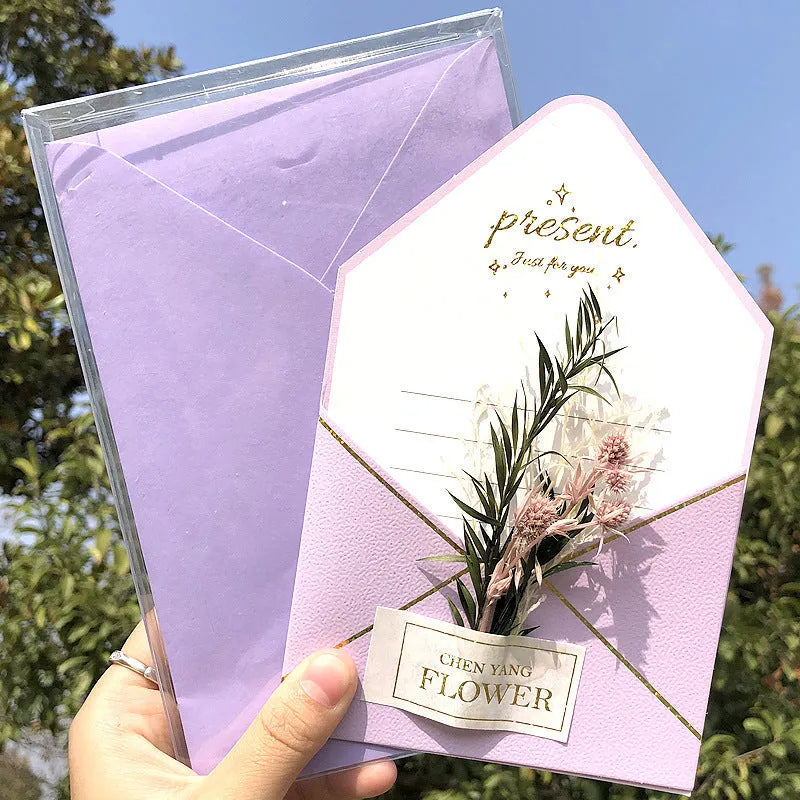 Handmade 3D butterfly-shaped birthday card with artificial flowers and hot foil stamping details.