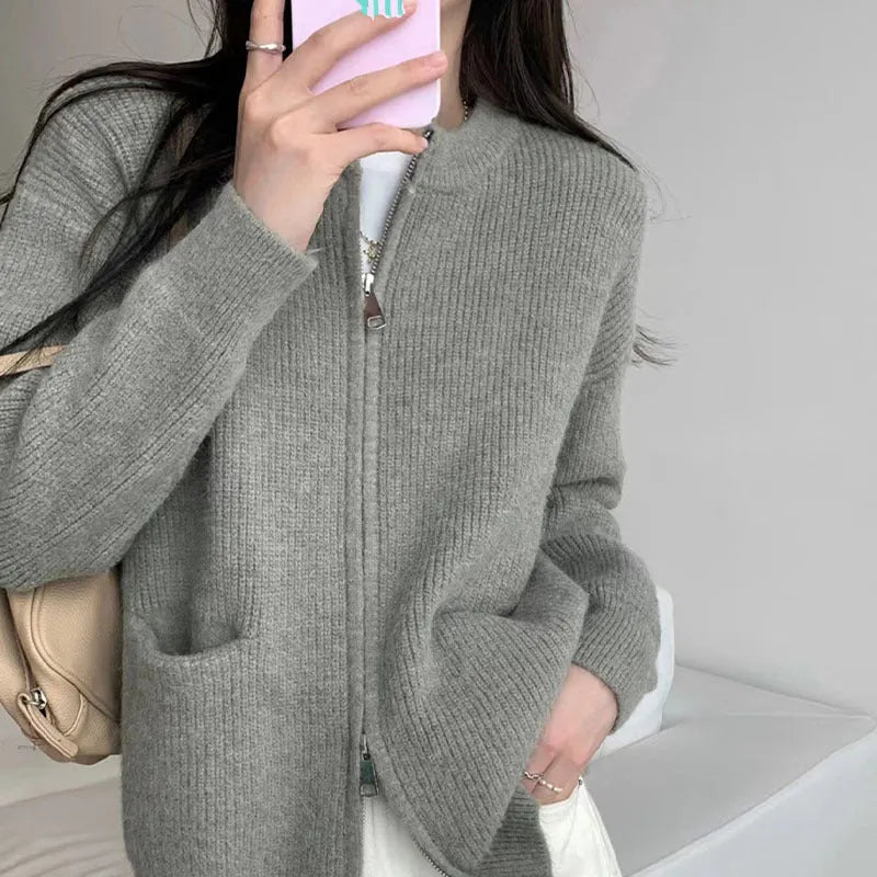 Beige women's soft viscose sweater coat cardigan with long sleeves on a hanger.