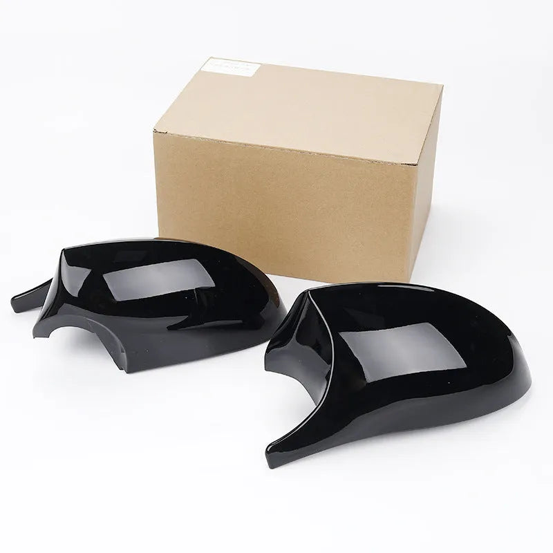 Pair of BMW 3 Series E90 ABS plastic rearview mirror housings in black and carbon pattern finishes