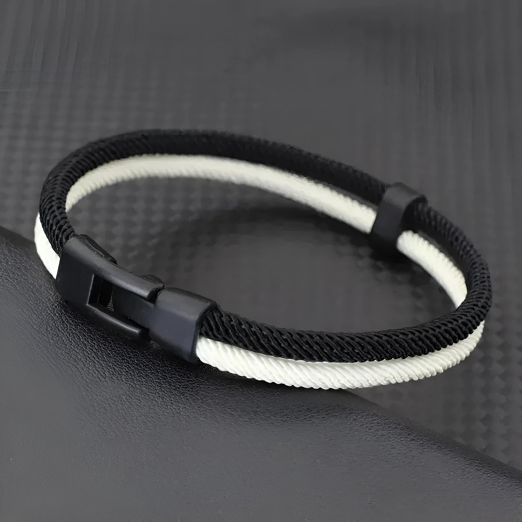 Black and white handmade woven hand strap made from Milan rope alloy