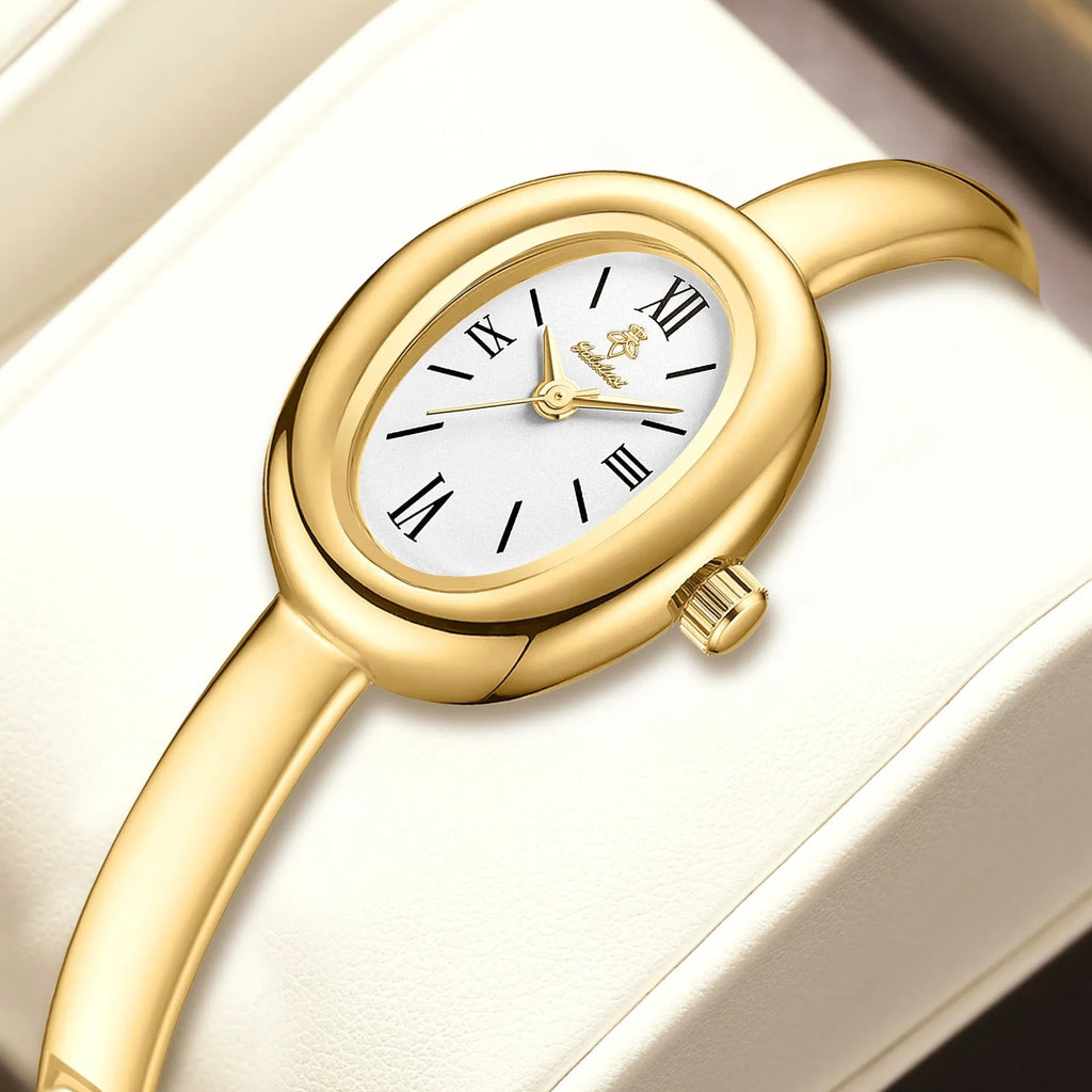 Women's oval retro quartz watch in gold colour with spiral pattern on 8mm slim case