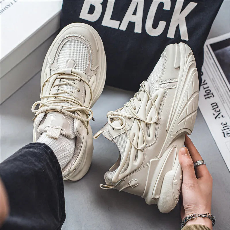 Men's low-top sneaker in beige with mesh PU leather upper, lace-up front, and a platform rubber sole.